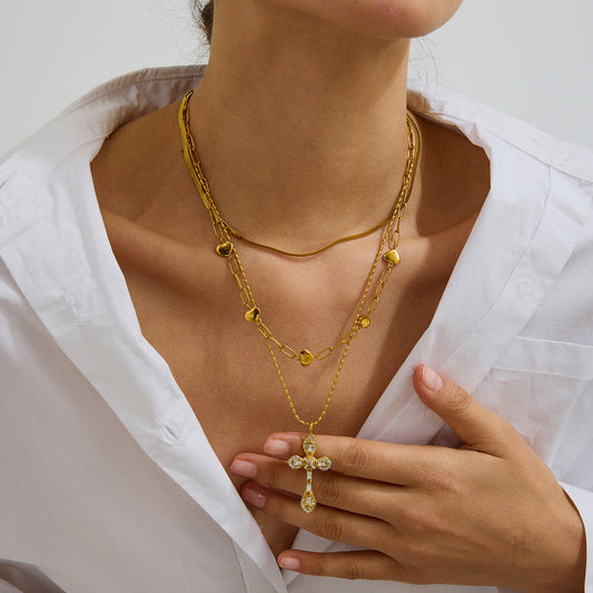 Slim White Zircon Cross Necklace worn by model layered styling