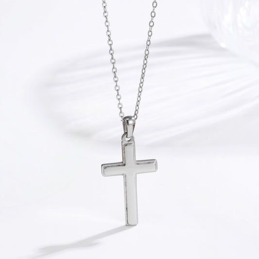 Men's steel silver classic cross necklace lifestyle flat lay