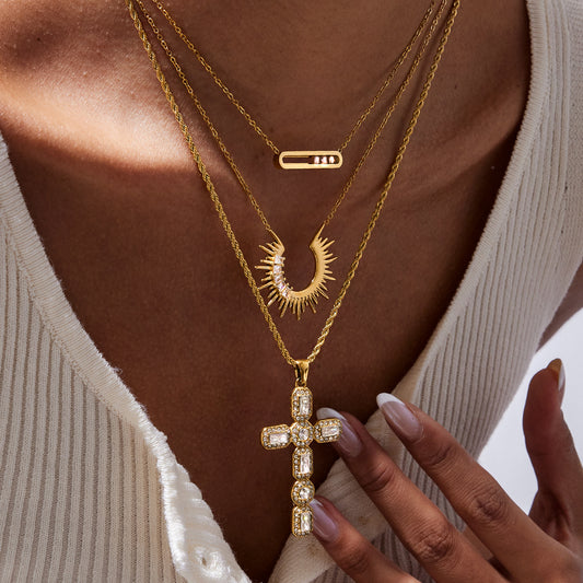 Bold White Zircon Cross Necklace flat lay with multiple styles