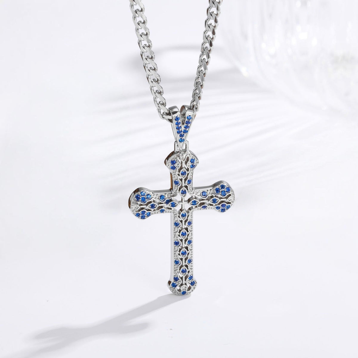 Silver hollow zircon cross necklace with blue stones on curb chain, stainless steel, faith jewelry for men