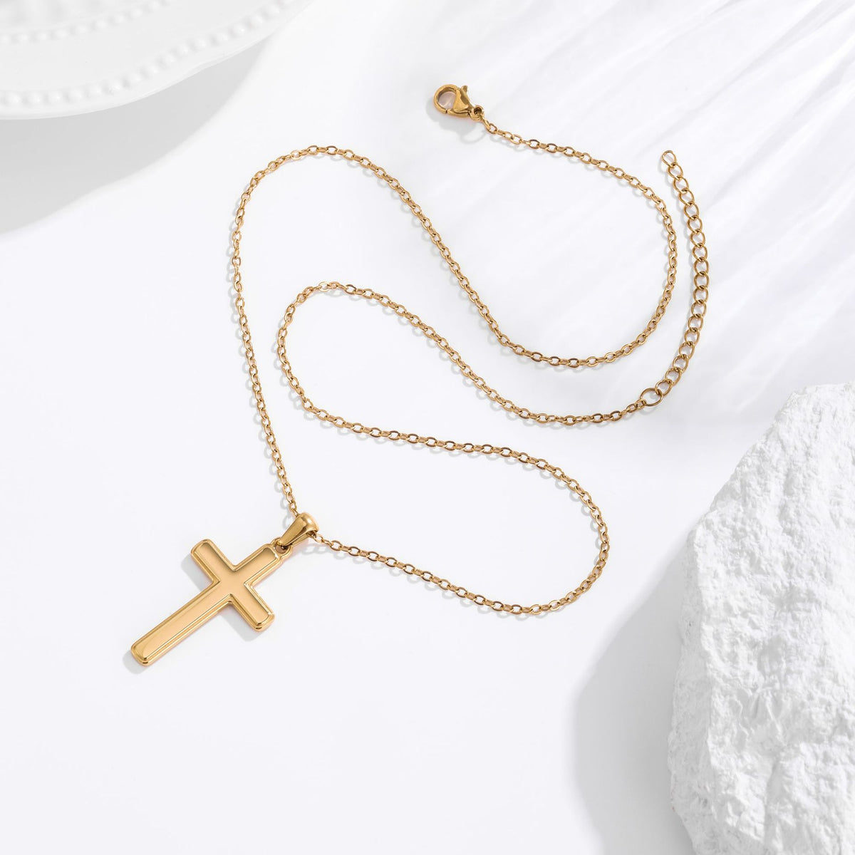 Men's gold classic cross necklace lifestyle flat lay